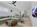 Virtually staged living room with L-shaped sofa and dining area at 4313 El Conlon Ave, Las Vegas, NV 89102