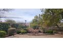 Secluded backyard featuring well-maintained landscaping, garden area and privacy at 1629 Black Fox Canyon Rd, Henderson, NV 89052