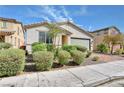 Attractive single-story home with mature landscaping, brick driveway, and neutral color palette at 3716 W Colton Ave, North Las Vegas, NV 89032