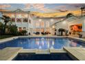 Resort-style pool and outdoor entertainment area with covered bar and seating, ideal for relaxation at 2349 Villandry Ct, Henderson, NV 89074