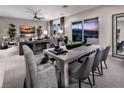 Modern dining room with large table and access to backyard at 9009 Shifting Skye St, Las Vegas, NV 89166
