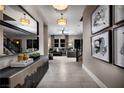 Bright and spacious entryway with tile floors and modern decor at 9009 Shifting Skye St, Las Vegas, NV 89166