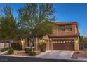 Two-story home with charming landscaping and a three-car garage at 8429 Brackenfield Ave, Las Vegas, NV 89178