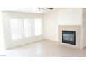 Living room features a fireplace and large windows at 6449 Elizabethtown Ave, Las Vegas, NV 89110