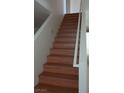 Wood staircase leading to the upper level of the home at 6449 Elizabethtown Ave, Las Vegas, NV 89110