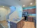 Island kitchen with granite countertops and stainless steel appliances at 4590 Lime Straight Dr, Las Vegas, NV 89115