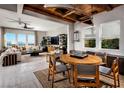 Open concept dining area with wooden table and chairs at 9003 Shifting Skye St, Las Vegas, NV 89166