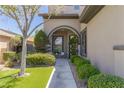 Inviting front entrance features manicured shrubs, rock landscaping, and seating area at 17 Winding Rd, Henderson, NV 89052