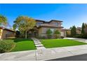 Beautiful two-story home with a well-manicured front lawn at 17 Winding Rd, Henderson, NV 89052