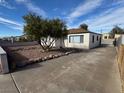 House exterior with driveway and desert landscaping at 132 W Victory Rd, Henderson, NV 89015