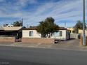 House exterior showcasing a large front yard and street view at 132 W Victory Rd, Henderson, NV 89015