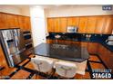 Modern kitchen with stainless steel appliances and an island at 9408 Forest Edge Ave, Las Vegas, NV 89149