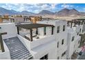 Aerial view of modern townhome community with mountain views at 651 Sentinel Spire St, Las Vegas, NV 89138