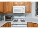 Image shows a gas cooktop, microwave, and built-in oven at 5855 Valley Dr # 1028, North Las Vegas, NV 89031