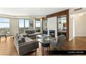Bright living room with hardwood floors, modern fireplace and views from large windows at 9101 Alta Dr # 1202, Las Vegas, NV 89145