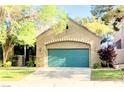 Charming home featuring a green garage door, front yard, and mature trees at 9809 Miss Peach Ave, Las Vegas, NV 89145