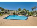 Sparkling community pool with lounge chairs at 750 S Royal Crest Cir # 353, Las Vegas, NV 89169
