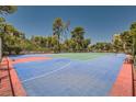 A colorful tennis court surrounded by mature trees at 750 S Royal Crest Cir # 353, Las Vegas, NV 89169