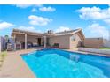 Refreshing blue pool with spacious patio, ideal for entertaining at 4657 Warner Pl, Las Vegas, NV 89115