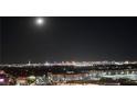 Stunning nighttime view of the city skyline at 9101 Alta Dr # 902, Las Vegas, NV 89145