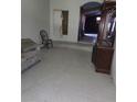 Modest living room featuring tile flooring with basic furniture and natural light at 4780 Horizon Ave, Pahrump, NV 89060