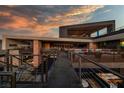Unique exterior architecture featuring walkways between buildings, offering a modern and open design at 685 Dragon Peak Dr, Henderson, NV 89012