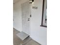 Inviting front door featuring a security gate and ramp for accessibility at 1828 Hassett Ave, Las Vegas, NV 89104