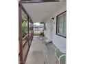 Relaxing covered porch provides shade and entryway to home, with security door for added peace of mind at 1828 Hassett Ave, Las Vegas, NV 89104