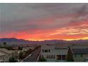 Community view with beautiful sunset in the background at 8620 Grove Mill Ct, Las Vegas, NV 89139