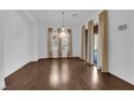 Bright dining room with hardwood floors and a chandelier at 45 Moltrasio Ln, Henderson, NV 89011