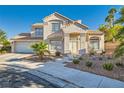 Two-story house with a landscaped front yard and attached garage at 8209 Crows Nest Ln, Las Vegas, NV 89128