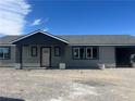 New construction showcasing a charming covered porch and windows, in a neutral color palette at 220 N David St, Pahrump, NV 89060