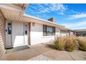 Charming home exterior with a well-manicured lawn and a welcoming front entrance at 360 E Kimberly Dr, Henderson, NV 89015