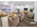 Bright living room with modern wood flooring, neutral paint and stylish contemporary furnishings at 1195 Sunfire St, Henderson, NV 89014