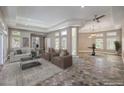 Spacious living room with modern decor, fireplace, and ample natural light, creating an inviting atmosphere at 2017 Slow Wind St, Las Vegas, NV 89134