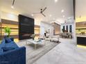 Bright, modern living room featuring a sleek fireplace, contemporary furniture, and stylish decor at 8780 Haven St, Las Vegas, NV 89123