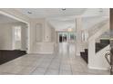 Bright and spacious entryway with tile floors and a staircase at 10914 Fintry Hills St, Las Vegas, NV 89141