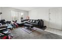 Living room with black sectional couch and coffee table at 2300 E Silverado Ranch Blvd # 1165, Las Vegas, NV 89183
