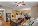 Open concept kitchen and dining area with hardwood floors and ample cabinetry at 9580 W Reno Ave # 238, Las Vegas, NV 89148
