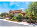 Two-story home featuring desert landscaping with a stone accents and an arched front gate at 2804 Josephine Dr, Henderson, NV 89044