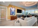 Luxury living room featuring a fireplace, large TV, and stylish decor at 4525 Dean Martin Dr # 2406, Las Vegas, NV 89103