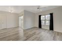A bright living room features modern flooring and a view to the outside at 7255 W Sunset Rd # 1140, Las Vegas, NV 89113