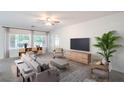 Bright living room featuring large windows, modern furniture and lots of natural light at 7625 Fieldfare Dr, North Las Vegas, NV 89084