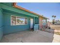 Charming covered front porch featuring unique brickwork and a convenient entry area at 425 Oil Lantern Ln, Las Vegas, NV 89145