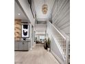 Bright and spacious entryway with high ceilings and modern light fixture at 7133 Serene Creek St, Las Vegas, NV 89131