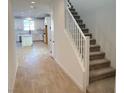 Bright entryway with view into kitchen and staircase at 6349 Laverick Dr, North Las Vegas, NV 89081