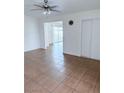 Open living room with tile flooring, ceiling fan, and sliding doors to the outside at 2509 Canosa Ave, Las Vegas, NV 89104