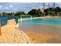Relaxing community pool with sandy beach entry and lake access at 3125 N Buffalo Dr # 1089, Las Vegas, NV 89128