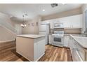 Spacious kitchen featuring white cabinets and an island at 3633 Water Song Dr, Las Vegas, NV 89147