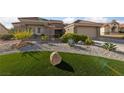Attractive home exterior featuring desert landscaping, a well-maintained yard, and an attached garage at 8517 Bayland Dr, Las Vegas, NV 89134